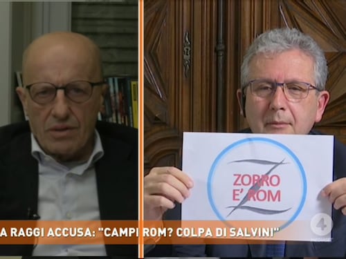"Adottiamo un rom" poi tira fuori il cartello su Antonio Banderas nomade. Incredibile Librandi da Del Debbio